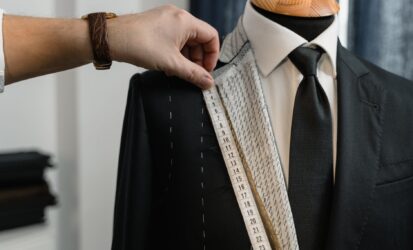 couturier measuring a suit s lapel